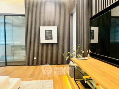 Modern living room with sleek wooden paneling and stylish decor