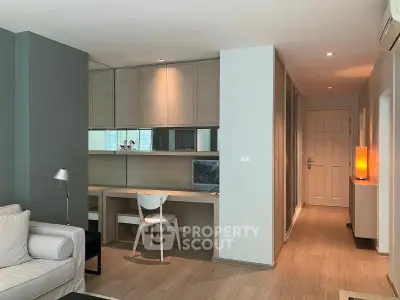 Modern living room with stylish study area and sleek wooden flooring