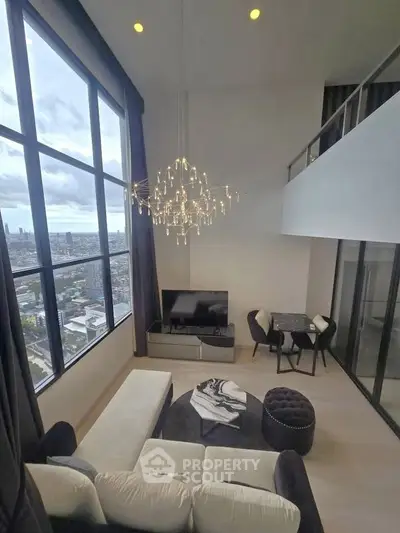 Luxurious high-rise living room with stunning city view and elegant chandelier.