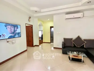 Spacious living room with modern air conditioning and sleek tile flooring