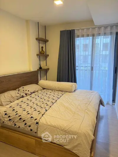 Cozy bedroom with modern decor and natural light from large window