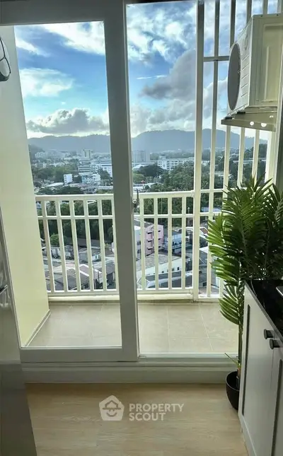 Stunning balcony view with lush greenery and cityscape, perfect for relaxation and enjoying the skyline.