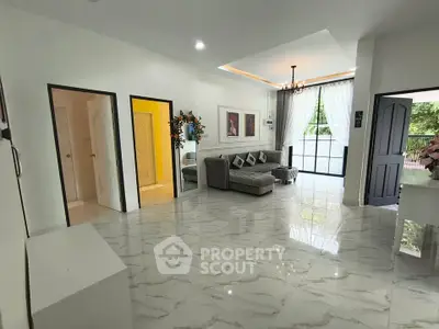 Spacious modern living room with elegant marble flooring and stylish decor