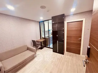 Modern compact living room with glass partition and cozy sofa