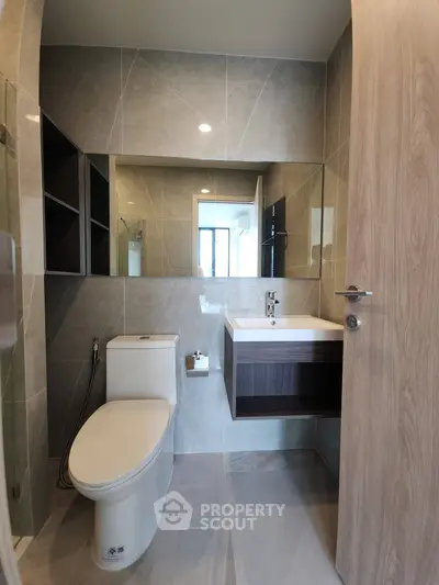 Modern bathroom with sleek design and elegant fixtures in a contemporary apartment.