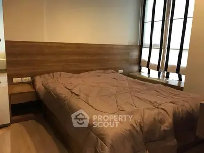 Cozy bedroom with wooden accents and natural light