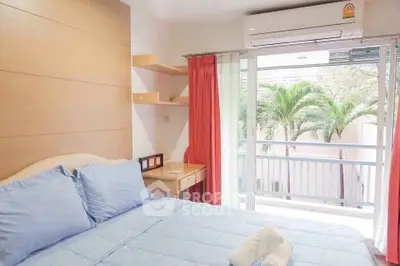 Bright bedroom with balcony and air conditioning, featuring modern decor and a serene view of palm trees.