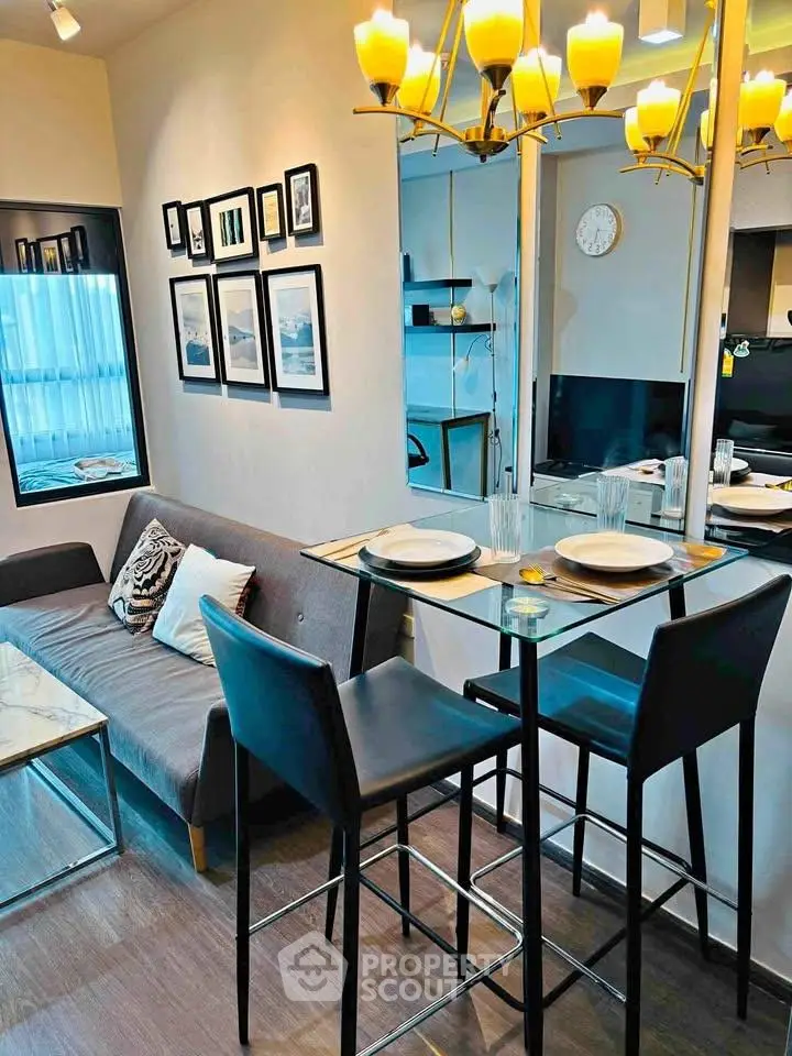 Modern living room with stylish decor and dining area in a cozy apartment.