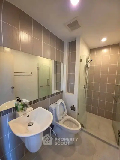 Modern bathroom with sleek design and glass shower enclosure