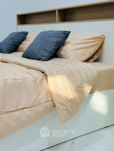 Elegant bedroom with modern design and cozy bedding, perfect for relaxation.