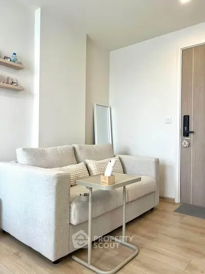 Modern living room with cozy sofa and stylish decor in a bright apartment.
