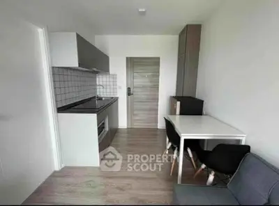 Modern compact kitchen with dining area in a stylish apartment