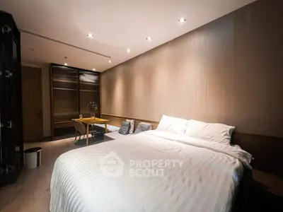 Luxurious bedroom with modern design and cozy ambiance, featuring a comfortable bed and elegant lighting.