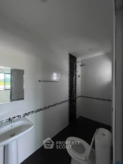 Modern bathroom with sleek design and shower area