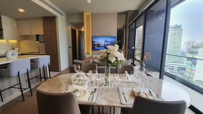 Luxurious modern living room with elegant dining area and stunning city view from large windows.