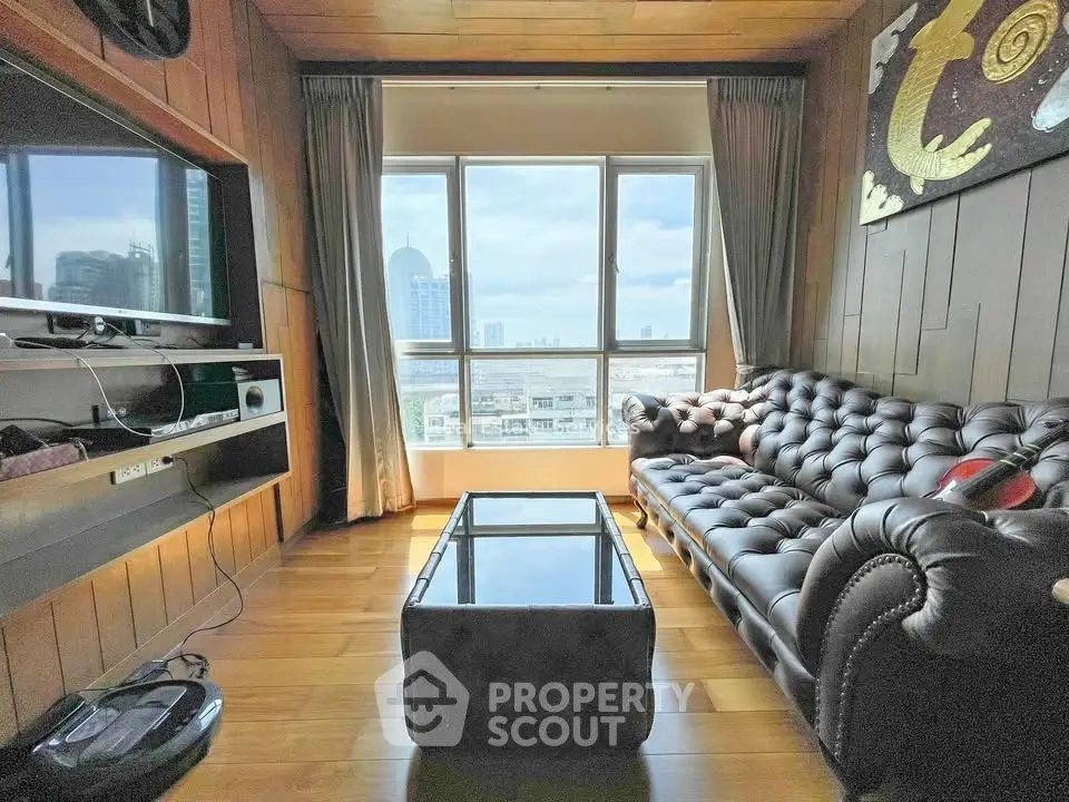 Luxurious living room with city view, leather sofa, and modern decor