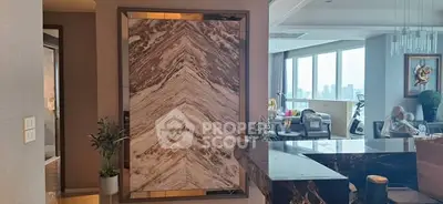 Luxurious modern living room with marble accents and city view