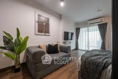 Modern living room with cozy sofa and balcony view