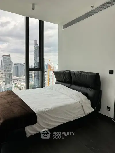 Luxurious bedroom with stunning city view and modern furnishings