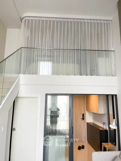 Modern loft apartment with mezzanine and sleek interior design