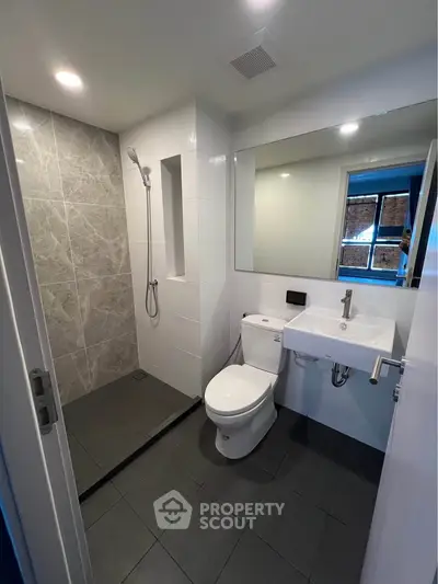 Modern bathroom with sleek shower and contemporary fixtures