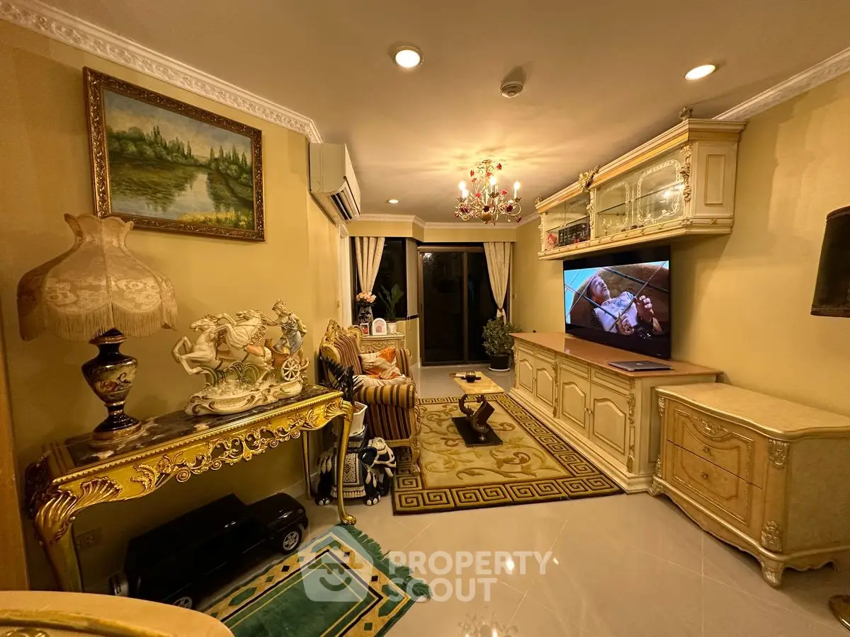 Luxurious living room with elegant decor and ambient lighting, featuring classic furniture and a cozy atmosphere.