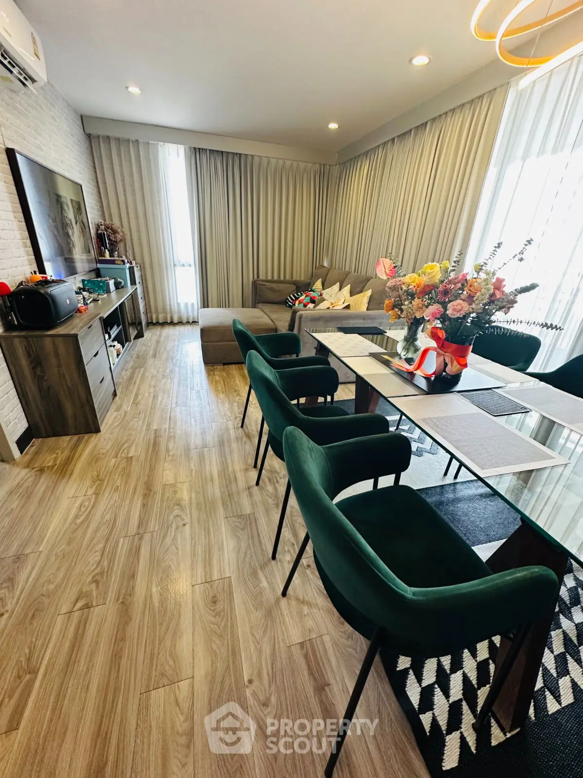 Stylish living room with elegant dining area and modern decor, perfect for entertaining guests.