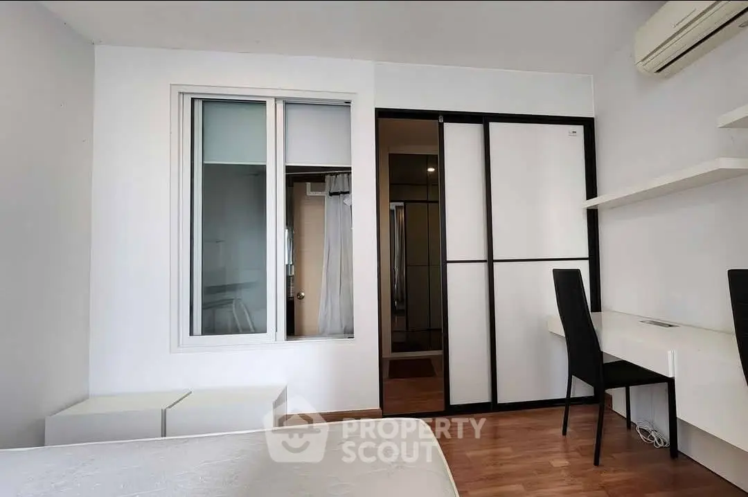Modern bedroom with sleek design and built-in storage solutions