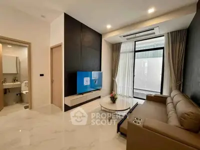 Modern living room with sleek design and large windows in a stylish apartment.