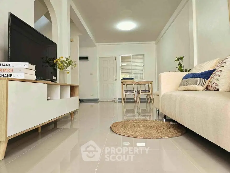 Modern living room with sleek furniture and stylish decor, perfect for comfortable living.