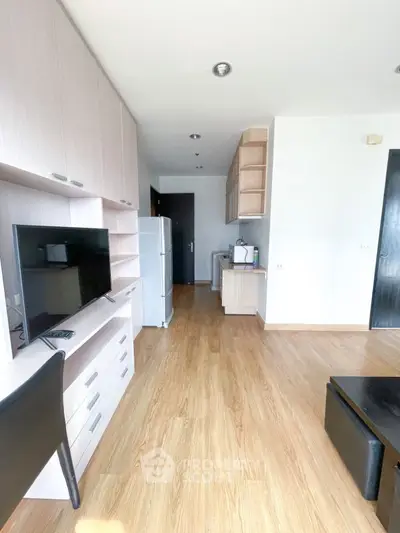 Modern apartment interior with wooden flooring and sleek furniture