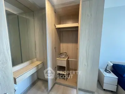 Spacious bedroom with built-in wooden wardrobe and modern design