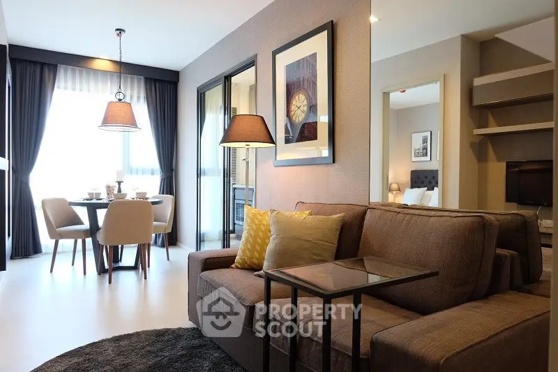 Modern living room with stylish decor and dining area in open layout apartment.