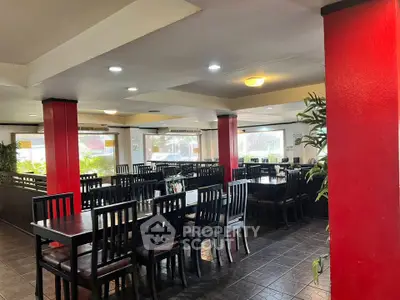 Spacious dining area with modern decor and ample seating, perfect for gatherings or events.