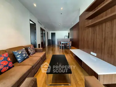 Spacious modern living room with wooden flooring and stylish furniture