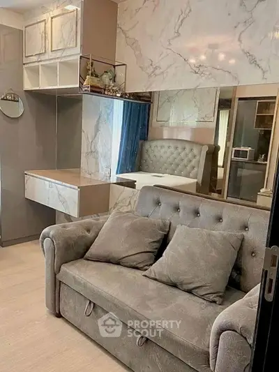 Luxurious living room with plush sofa and elegant marble accents