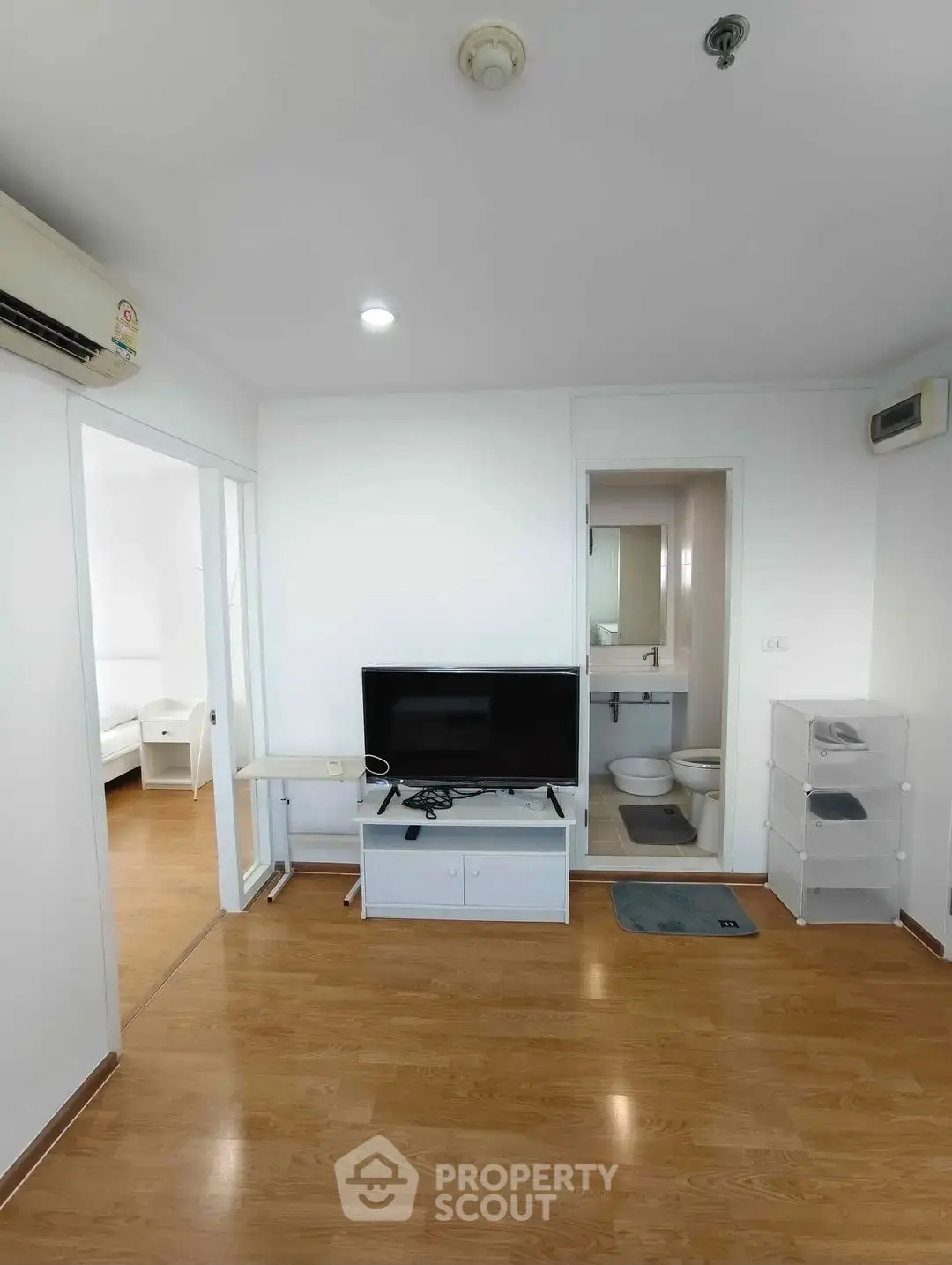 Modern apartment interior with wooden flooring and sleek furnishings