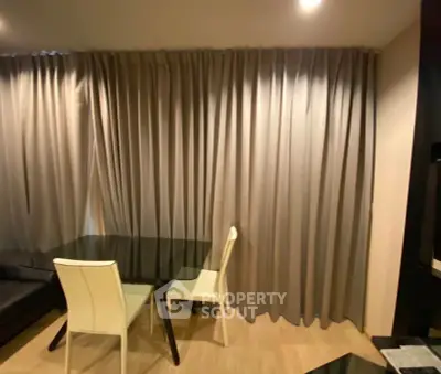 Modern living room with elegant curtains and stylish dining area