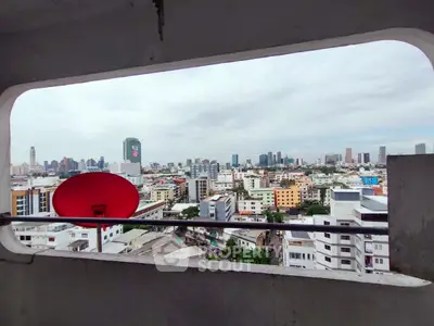 Stunning cityscape view from a high-rise balcony with skyline and urban landscape.