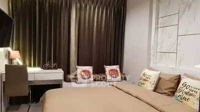 Cozy bedroom with stylish decor and modern furnishings, perfect for relaxation.