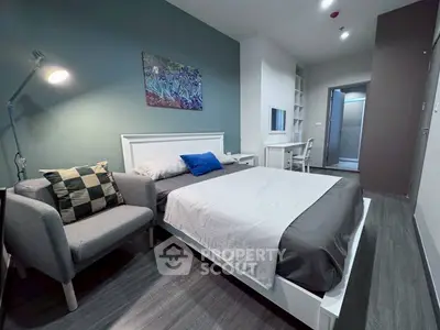 Modern bedroom with stylish decor and cozy ambiance, featuring a comfortable bed and elegant furnishings.