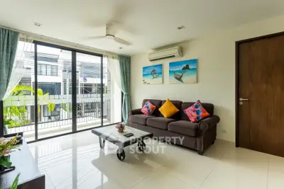Bright and modern living room with balcony view, stylish decor, and ample natural light.