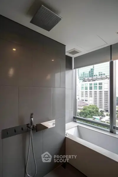 Luxurious bathroom with city view and modern fixtures