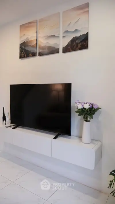 Modern living room with sleek TV setup and elegant decor
