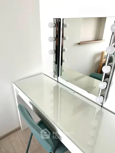 Modern vanity setup with mirror and lights in stylish bedroom corner