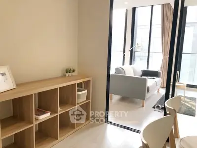 Modern living room with stylish furniture and large windows offering ample natural light.