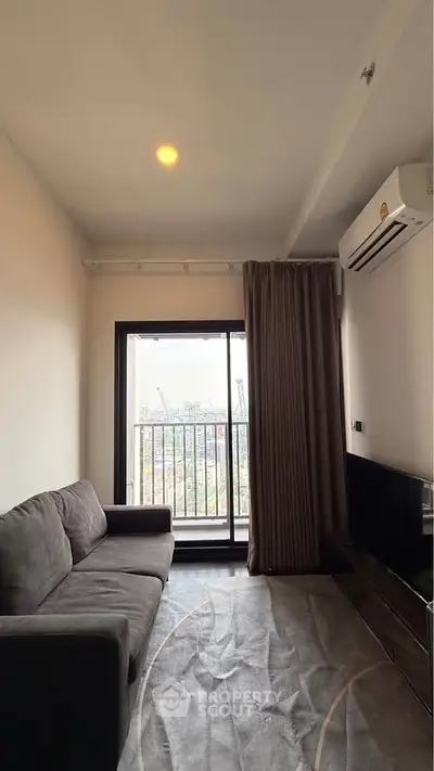 Cozy living room with balcony view in modern apartment