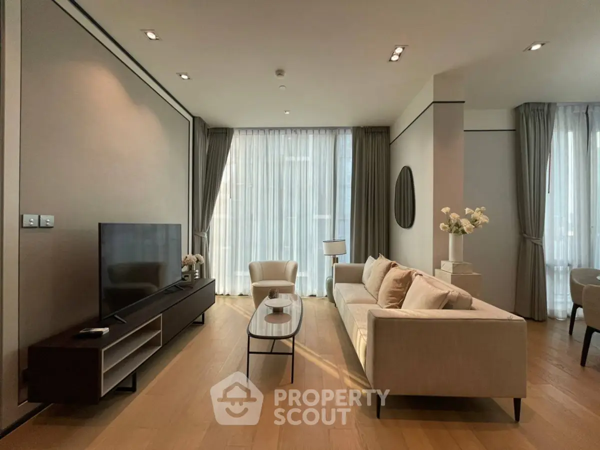 Elegant modern living room with large windows and stylish furniture