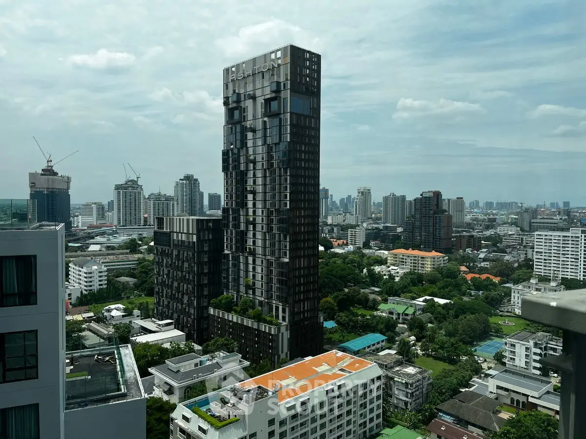 Stunning cityscape view featuring a modern high-rise building with lush greenery and urban skyline.