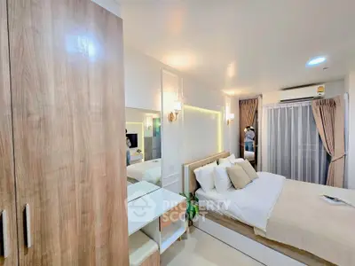 Modern bedroom with cozy decor, wooden wardrobe, and soft lighting for a relaxing ambiance.